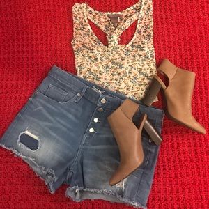High-waisted button-front distressed denim shorts